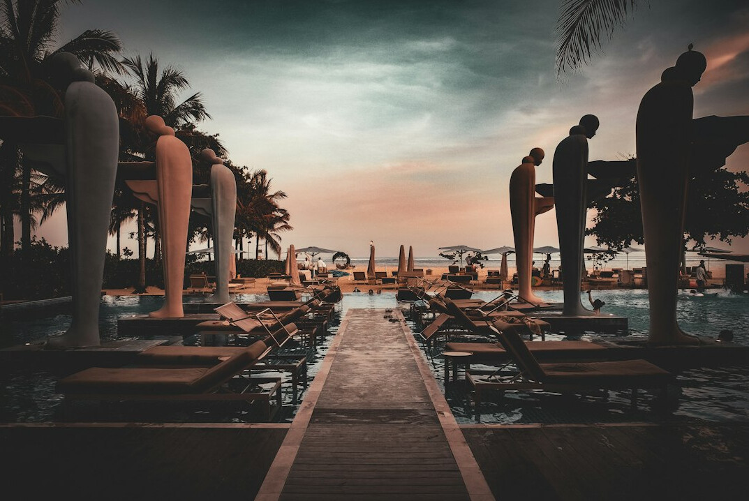 Luxurious poolside lounge at sunset