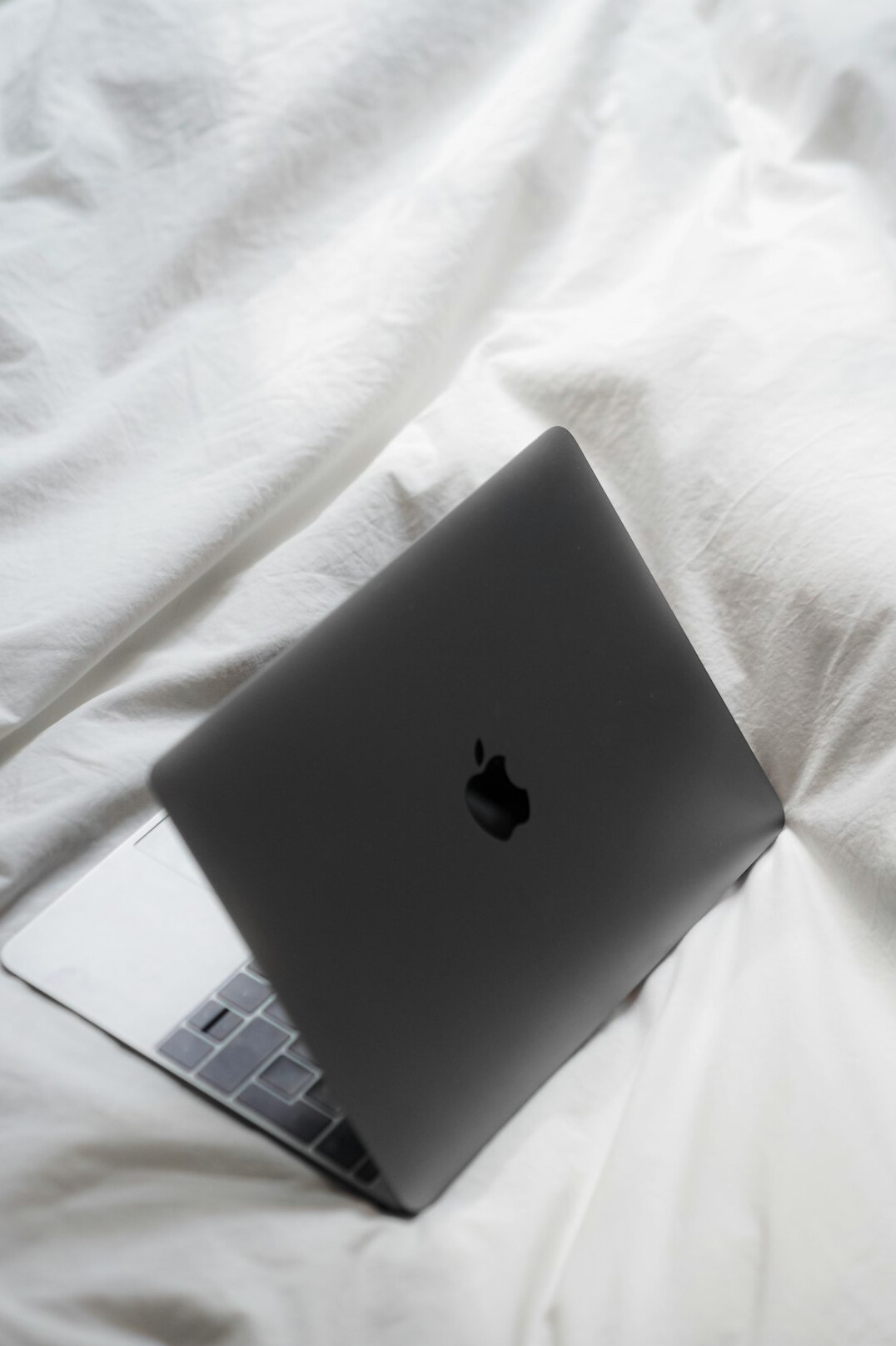Writer typing an article on a laptop